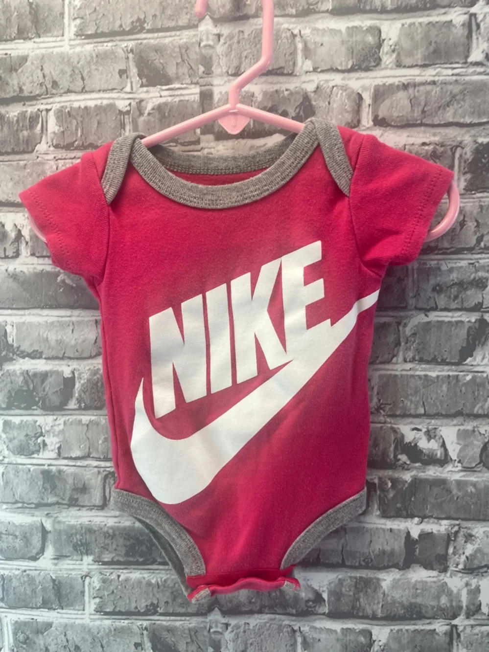 Nike Pink and  White Logo Infant Bodysuit‎ Wall Display